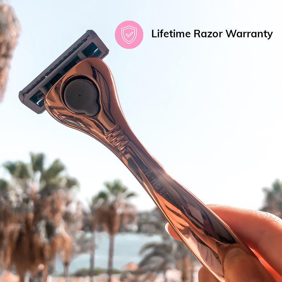 Hand holding an engraved FFS Beauty Rose Razor Kit outdoors against a sunny sky, with Lifetime Warranty badge
