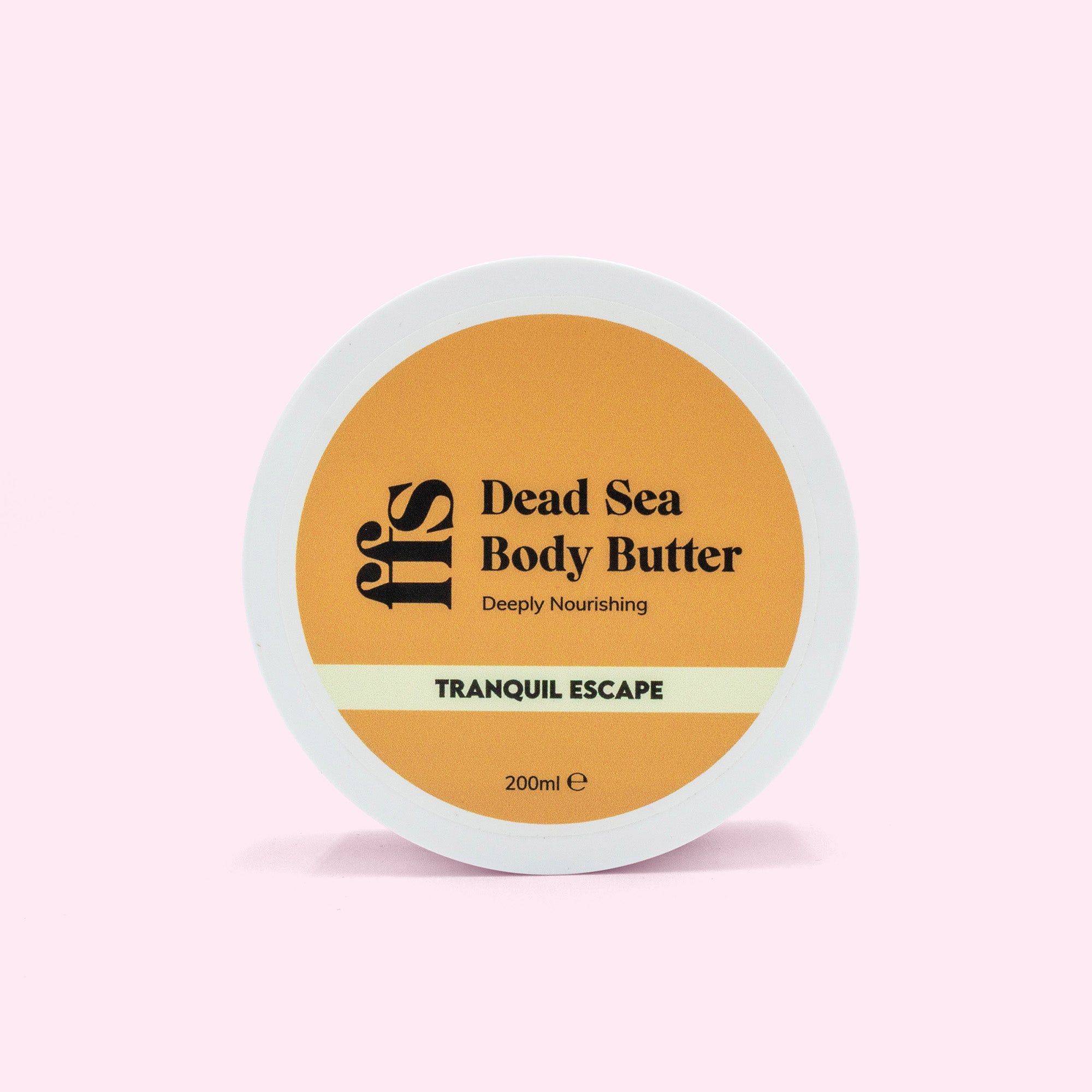FFS Dead Sea Body Butter in Tranquil Escape, 200ml tub viewed from above showing the amber lid label